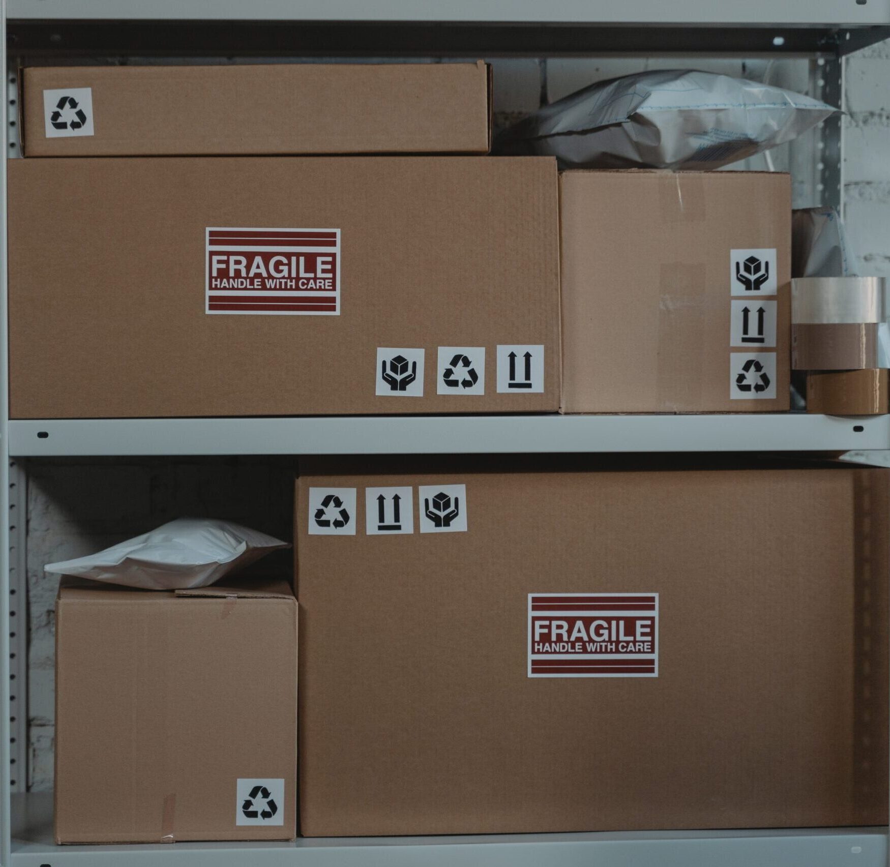 stacked boxes and packages on shelves